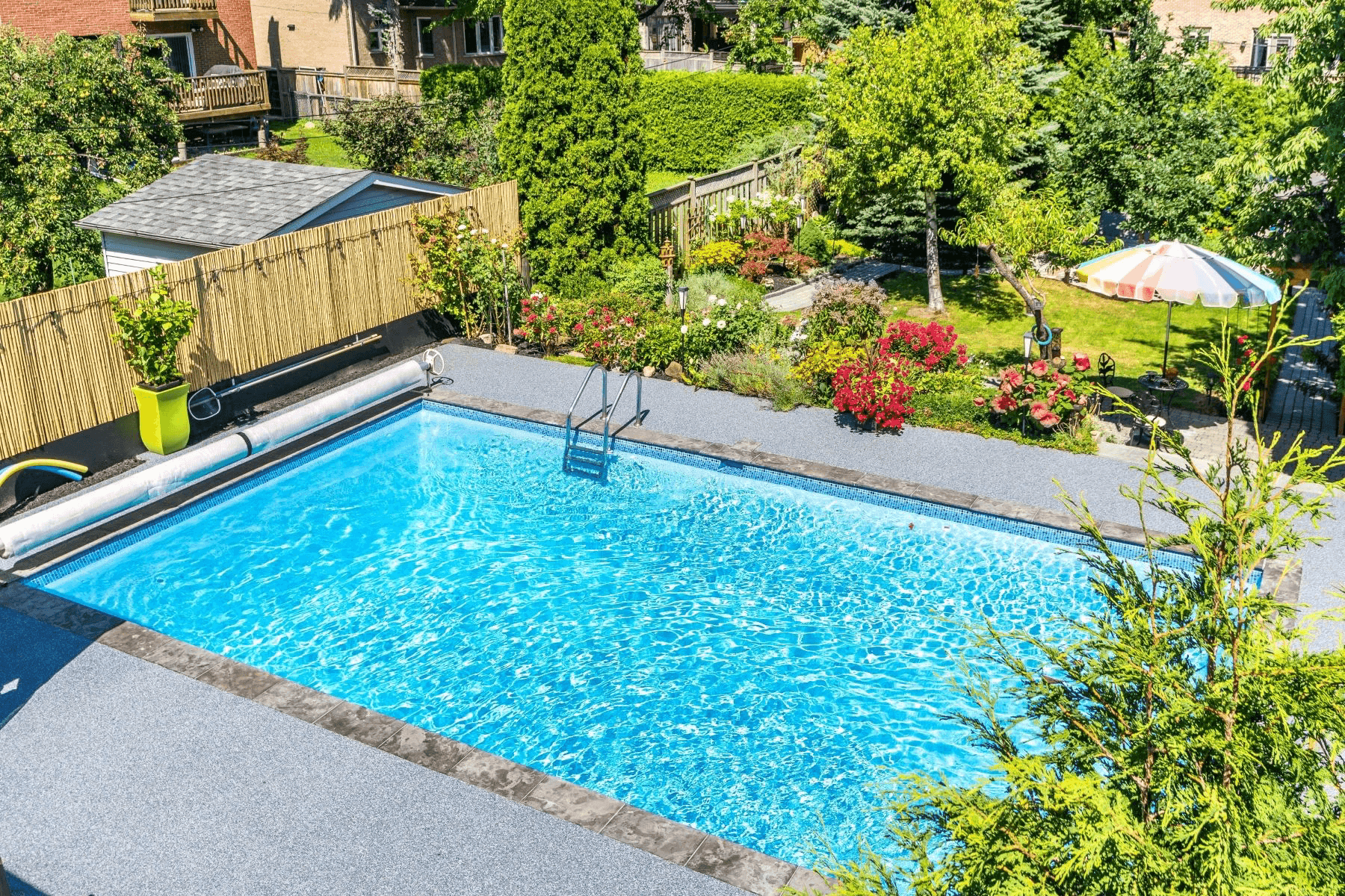 Rubberkrete soft rubber resurfacing applied around an inground pool in a London, Ontario backyard